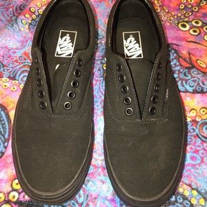 Solid black Vans